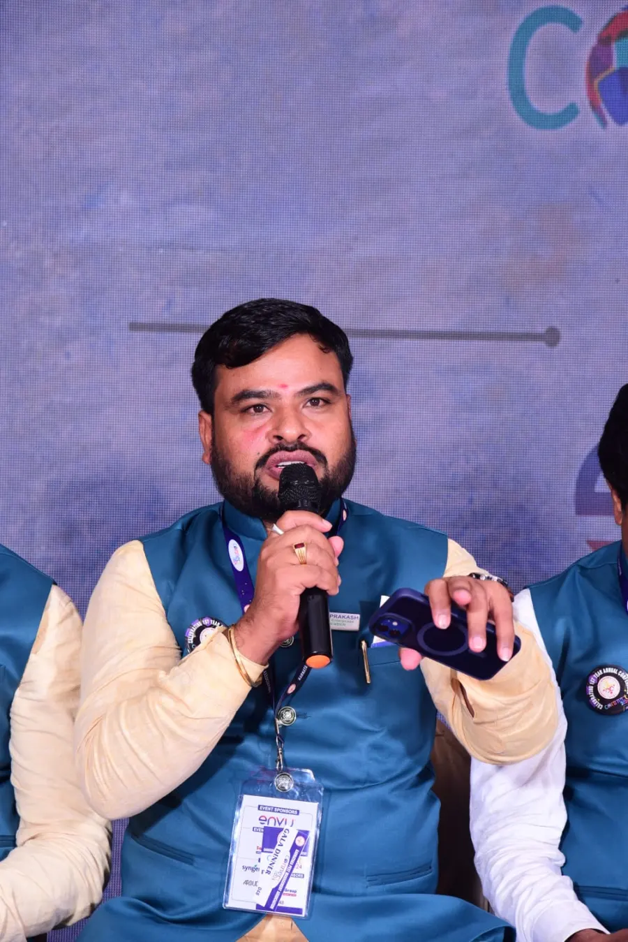 Prakash speaking at an industry conference