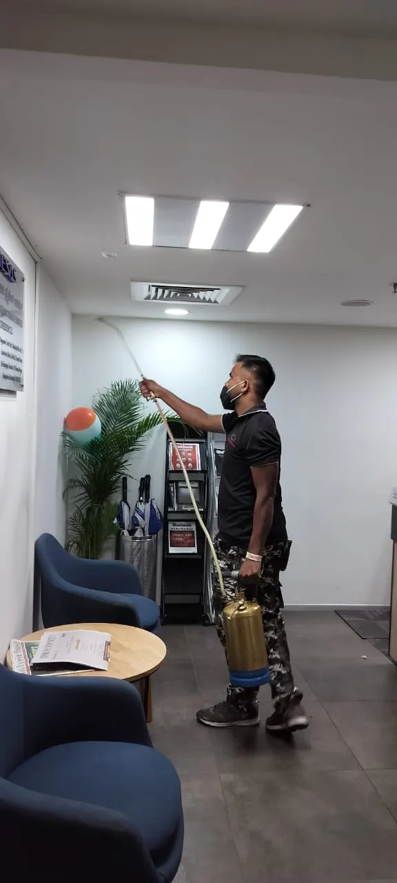 Technician treating a corporate office