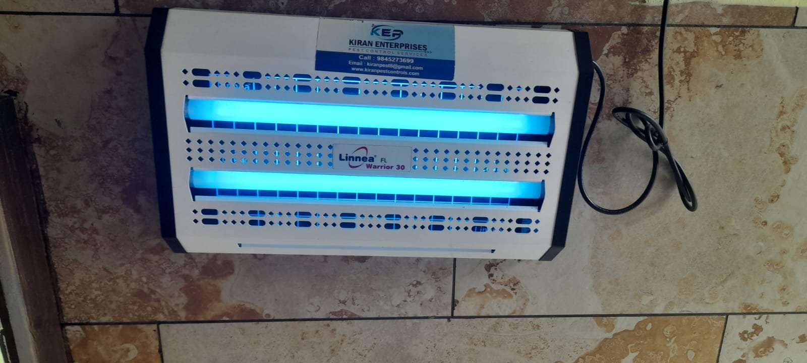 UV fly control system installed in an indoor commercial space